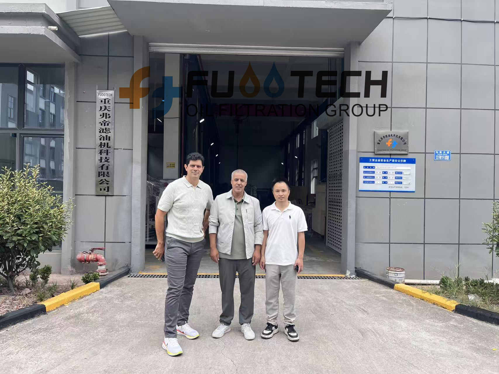 Group Photo in Front of Factory.jpg